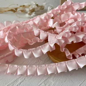 Pink pleated satin ribbon with ruffled edges for DIY crafts and garment decoration