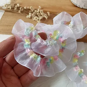 White organza scrunchie with pastel colored wavy edges for women and girls