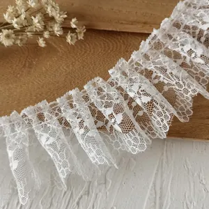 White pleated lace trim with floral mesh patterns for DIY clothing and crafts