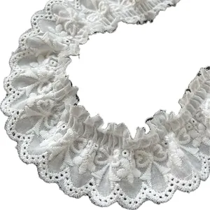 White embroidered cotton lace trim with ruffled wavy edges for DIY sewing and crafts