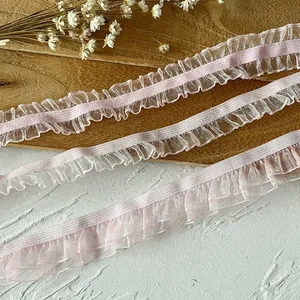 Detail of pink pleated lace trim for DIY projects and doll clothes decoration