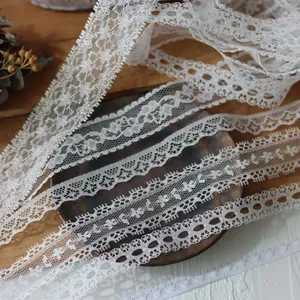 5-meter roll of premium white eyelash lace trim with hollow floral patterns for DIY crafts