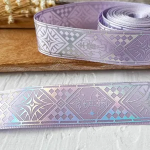 Lavender decorative ribbon with silver holographic geometric patterns and star elements