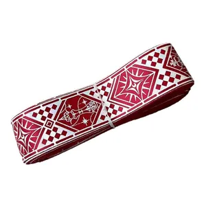 Folk style red and white jacquard ribbon roll with geometric star and crown patterns