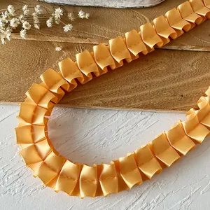 Bright yellow pleated satin lace trim with elegant U-shaped folds for DIY crafts
