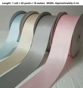 Rolls of 4cm double-sided satin ribbons in blue, white, grey, and pink for wedding crafts