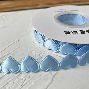 Light blue heart-shaped lace ribbon roll made of polyester for DIY craft decoration