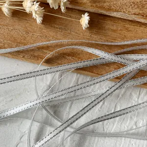 Silver metallic ribbon with woven edges for handmade DIY crafts and gift wrapping