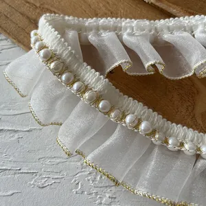 White ruffled lace trim with pearls and gold stitching for DIY sewing and crafts