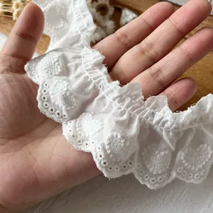 White cotton lace trim with heart embroidery and scalloped edges for garment decoration