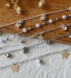 Detail of DIY silver chain with charms showing stars, hearts and pearls, 0.5m length
