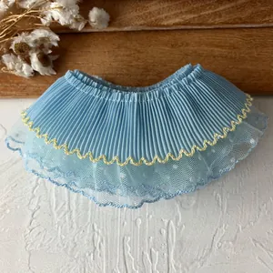 Double-layered blue pleated lace trim with polka dots and yellow scalloped edges