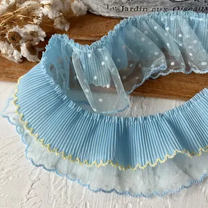 Blue ruffled polka dot lace trim with yellow scalloped edges for DIY sewing and doll dresses