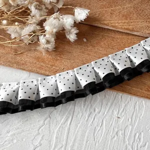 Detail view of double-layer black and white polka dot pleated ribbon for DIY crafts