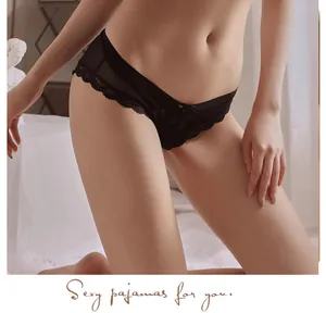 Close-up of black mesh lace panties featuring a low waist and elegant bow detail