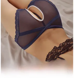 Detail view of sheer dark blue mesh panties with intricate lace trim and cut-out design