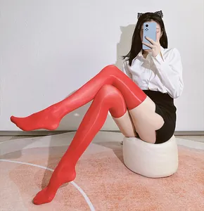 Glossy red over-knee stockings with high-shine satin finish and elastic fit