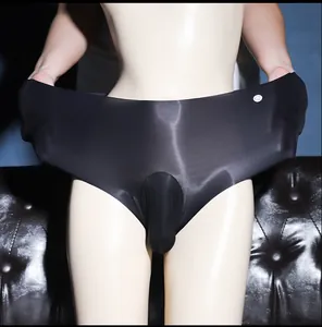 Macro detail of men's glossy black seamless ice silk briefs with ultra-thin pouch design