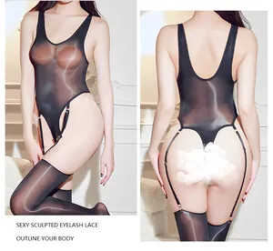Detail view of black sheer bodysuit with integrated stockings and translucent lace texture
