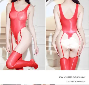 Detail view of shiny red crotchless bodysuit with high-slit stockings set in macro shot