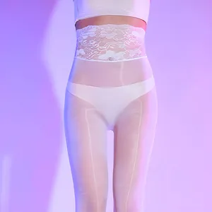 Detailed close-up of high-waist white floral lace waistband on sheer tights