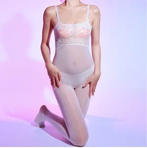 Detail of white lace and sheer mesh bodysuit featuring floral patterns and slim straps