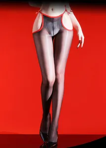 Detail of sheer glossy black stockings with red contrast trim and open cutout design