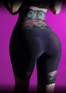 Detail of high waist slimming briefs with green floral embroidery and lace trim on black