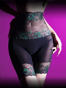 Detail view of high waist lace shapewear with black mesh and green floral embroidery