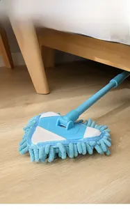 Long-handle triangle microfiber mop cleaning dust under furniture on wooden floors