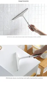 Close-up of the grey silicone squeegee blade removing water from a tiled surface