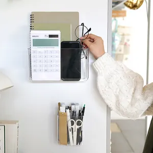 Wall-mounted clear acrylic storage organizers with adhesive backing for office stationery