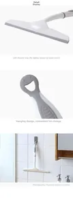 Detail of handheld window squeegee with soft silicone blade and smiley hanging hole