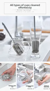 Long handle sponge brush cleaning various glassware like bottles and glass jars