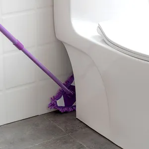Purple triangular microfiber mop with extendable handle cleaning a bathroom corner