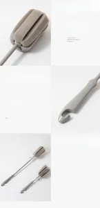 Detailed view of soft sponge brush head and long handle with integrated hanging hook