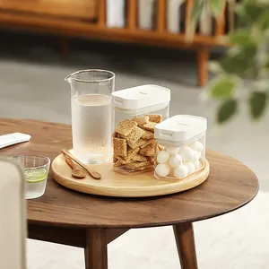 Airtight clear storage jars with white lids for kitchen food and grain organization