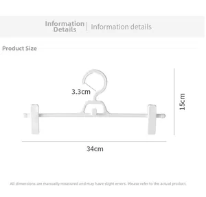 Detailed size chart showing 34cm width and 15cm height of the white plastic pants hanger