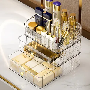 Three-tier transparent acrylic cosmetic organizer with gold handles and diamond texture