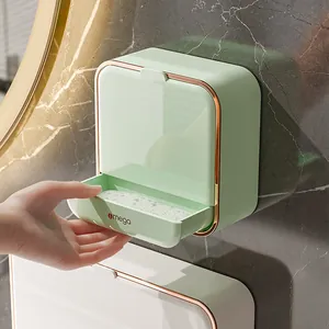 Aan de muur gemonteerd muntgroen zeepbakje met roségouden rand en lade voor badkamer