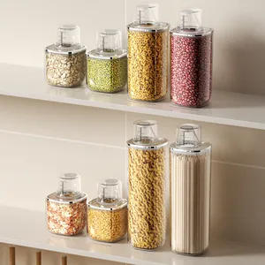 Set of clear plastic food storage containers with measuring lids on a white kitchen shelf
