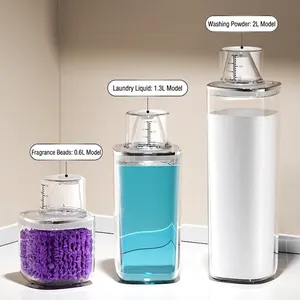 Set di 3 barattoli trasparenti per lavanderia con tappi dosatori in misure 0.6L, 1.3L e 2L