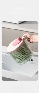 U-shaped spout detail on a salad spinner for easy pouring and draining vegetables