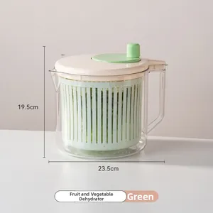 Macro shot of manual salad spinner with volume scale markings and ergonomic handle