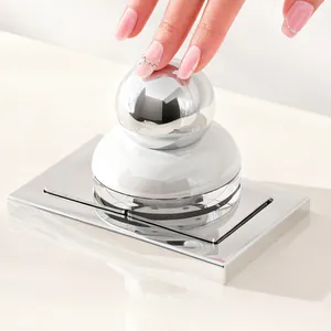 Hygienic toilet seat lifter with a chrome spherical handle and suction base
