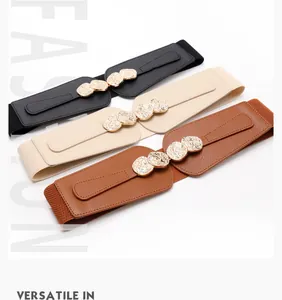 Close-up of vintage coin buckle and elastic band details on stylish women belts