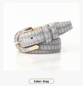 Close-up of grey crocodile embossed PU leather belt with polished gold alloy U-shaped buckle