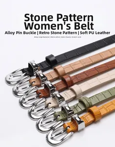 Detailed view of women's skinny PU belts with retro stone texture and silver buckles