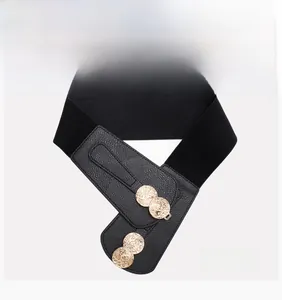 Detail of black elastic corset belt with vintage gold coin buckle and litchi leather