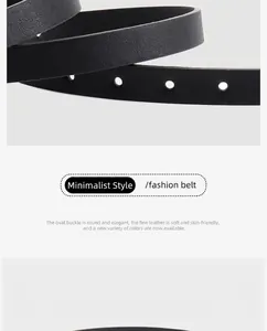 Détail d'une ceinture en cuir noir avec boucle ovale minimaliste et texture fine